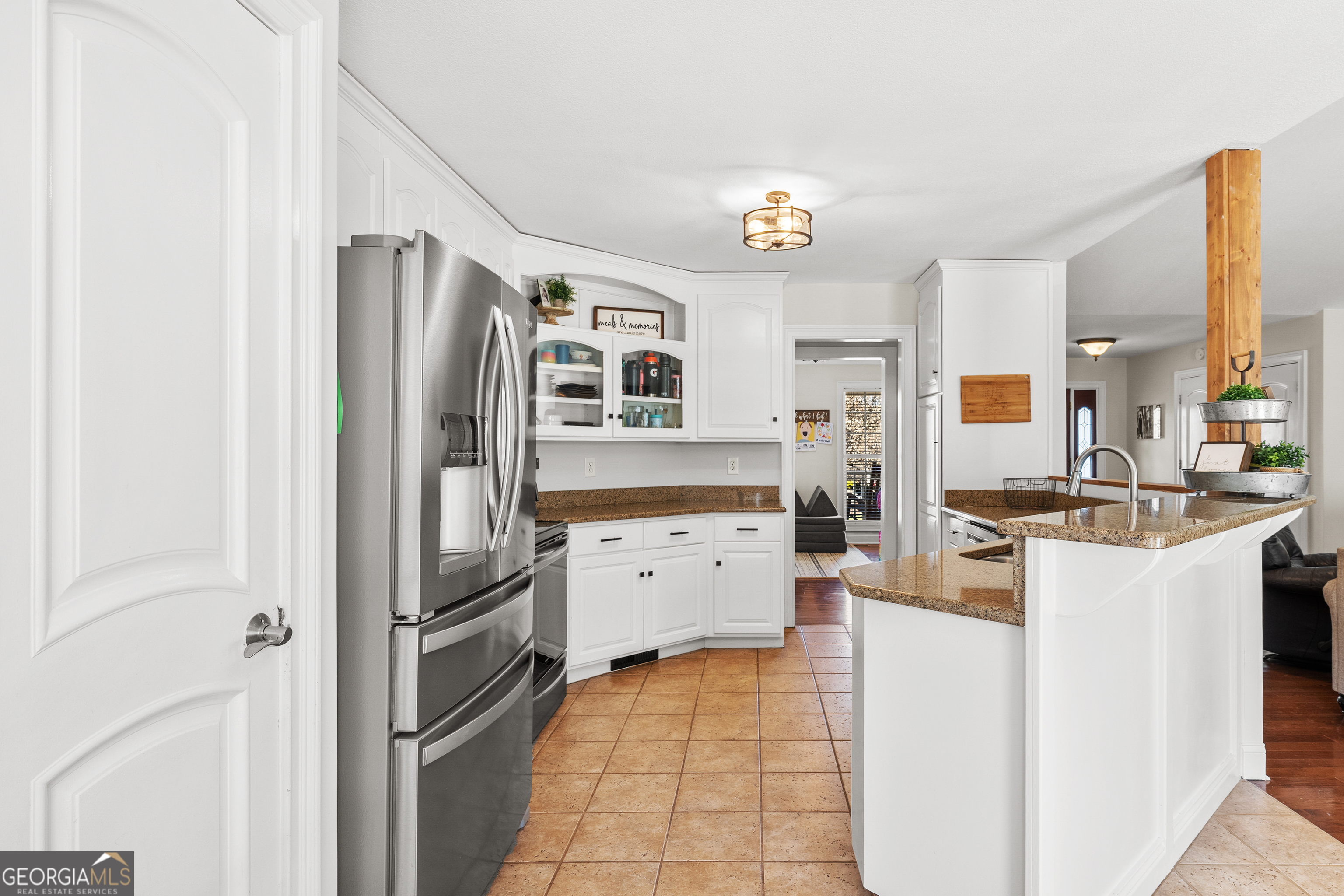 175 Highland Ridge Drive Hartwell, GA 30643 - Photo 14 of 46 a kitchen with stainless steel appliances a refrigerator sink and cabinets