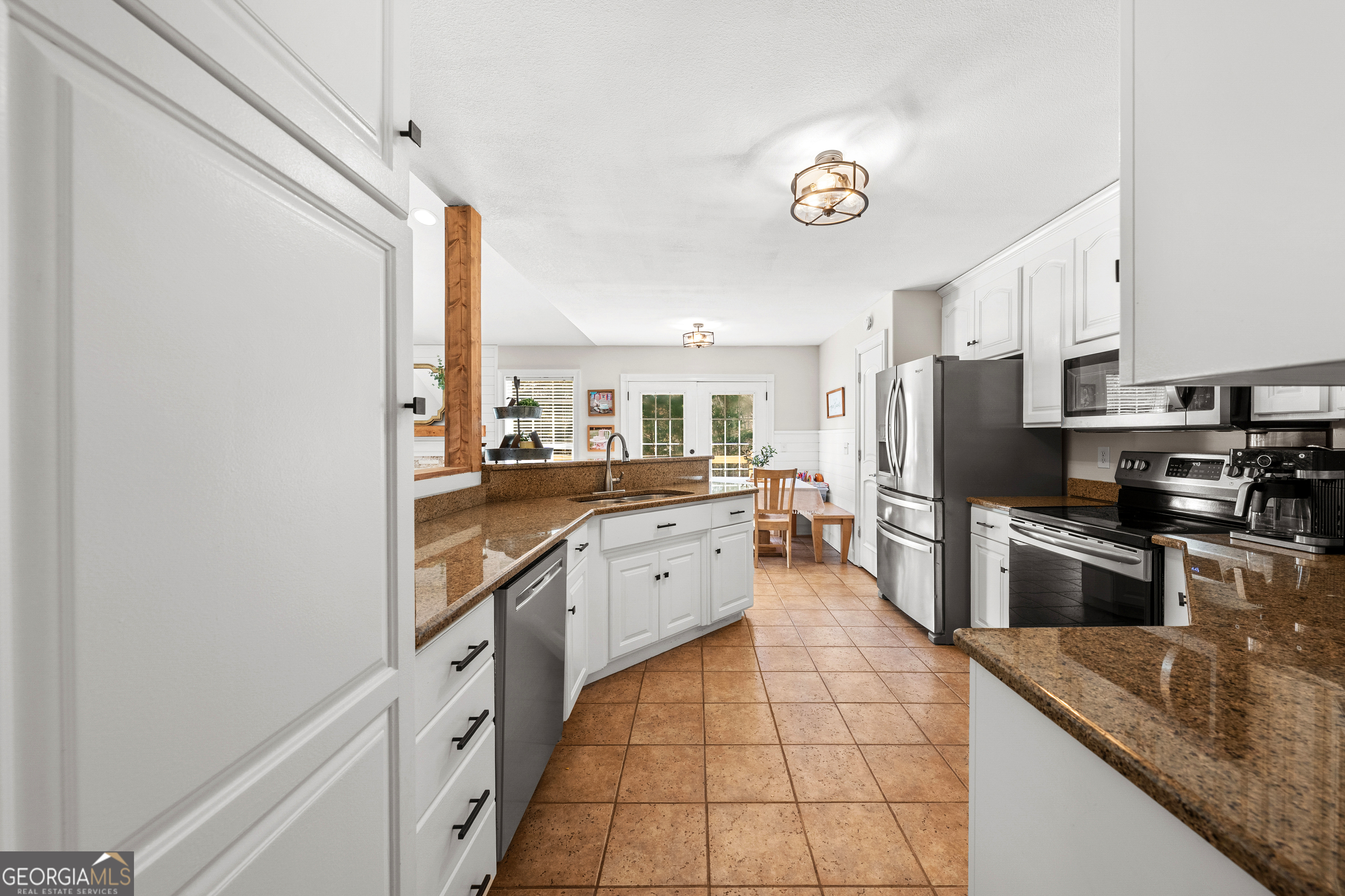 175 Highland Ridge Drive Hartwell, GA 30643 - Photo 15 of 46 a large kitchen with a refrigerator a stove top oven and a sink