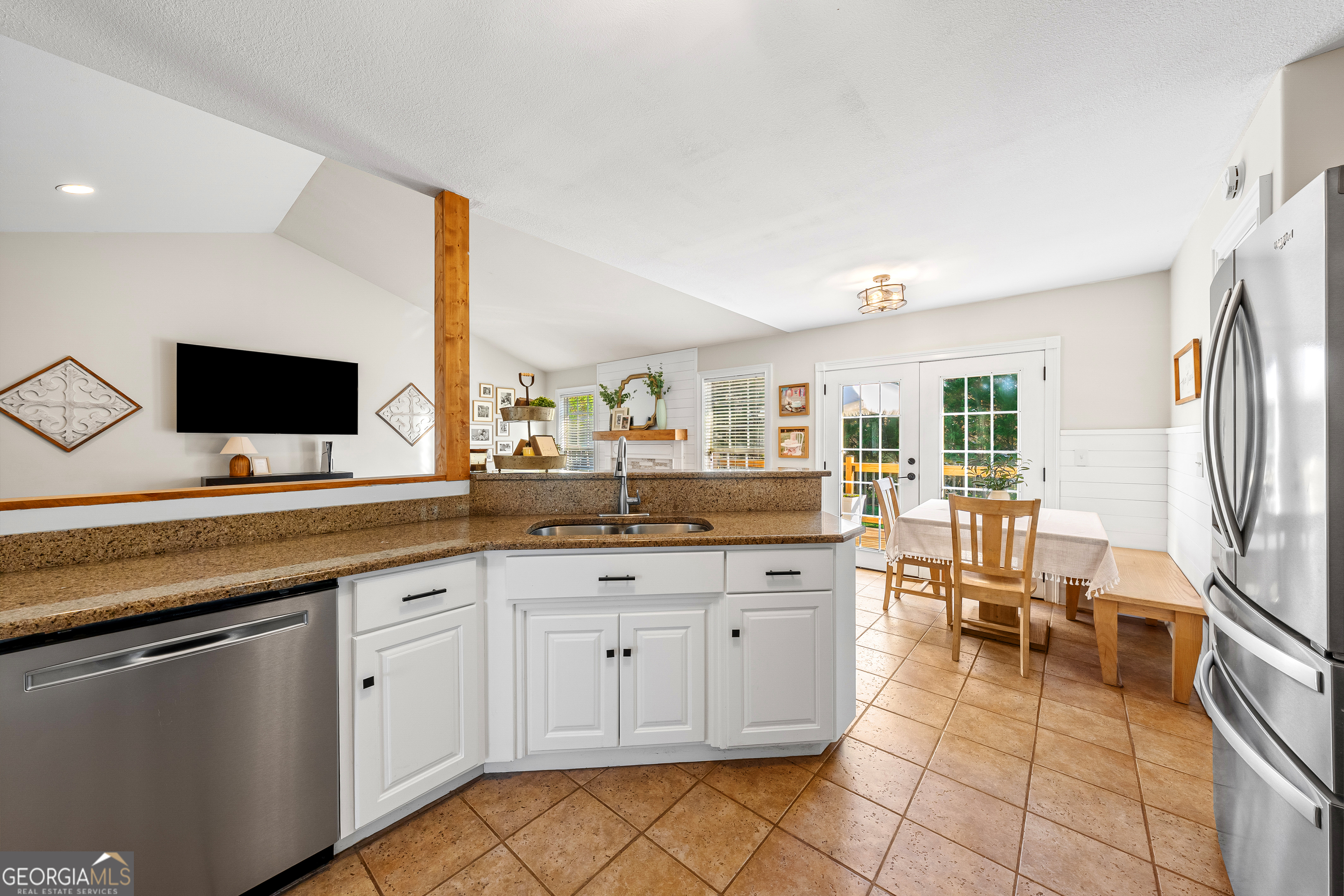 175 Highland Ridge Drive Hartwell, GA 30643 - Photo 16 of 46 a open kitchen with granite countertop a sink and white cabinets