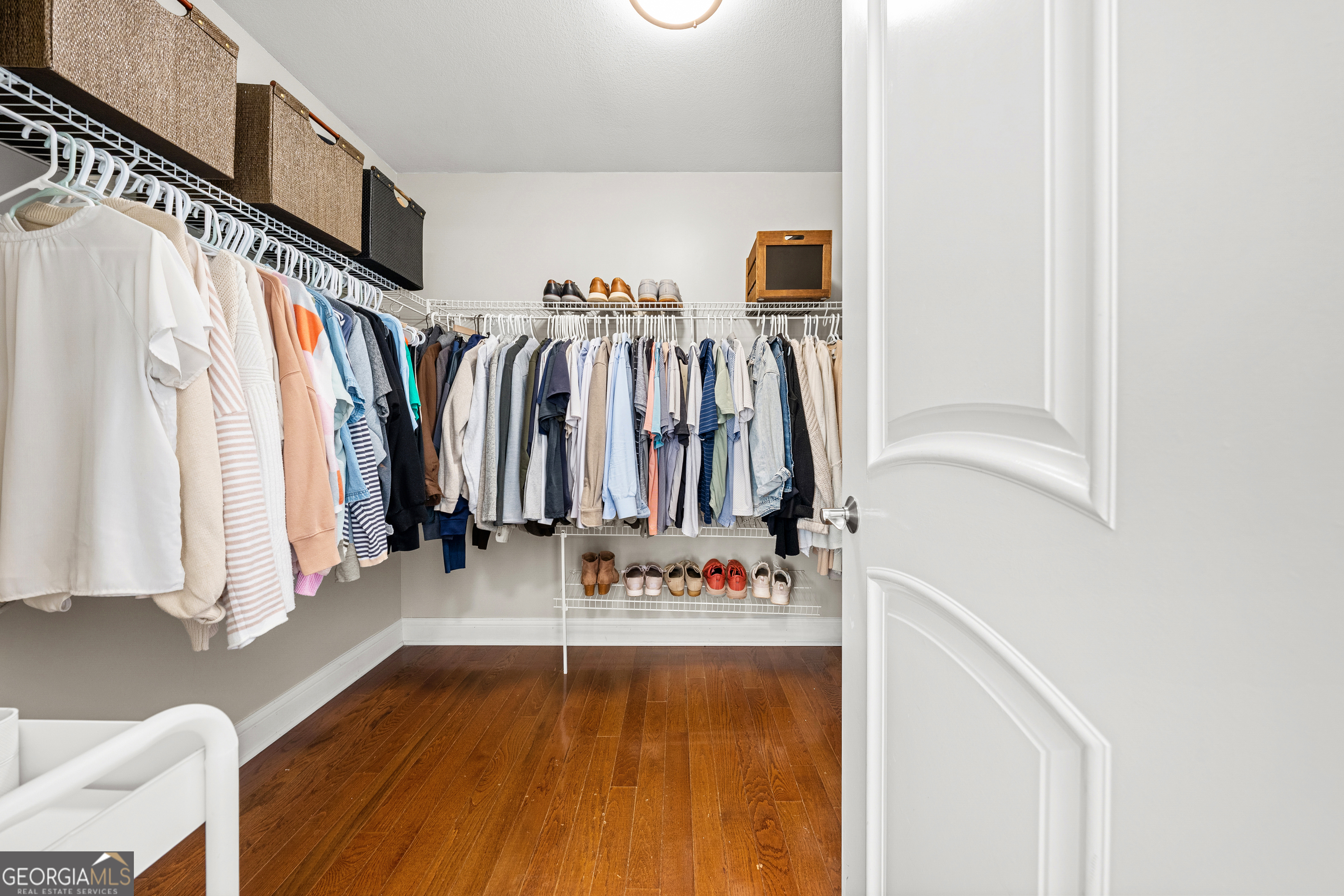 175 Highland Ridge Drive Hartwell, GA 30643 - Photo 26 of 46 a view of walk in closet with clothes and shoes