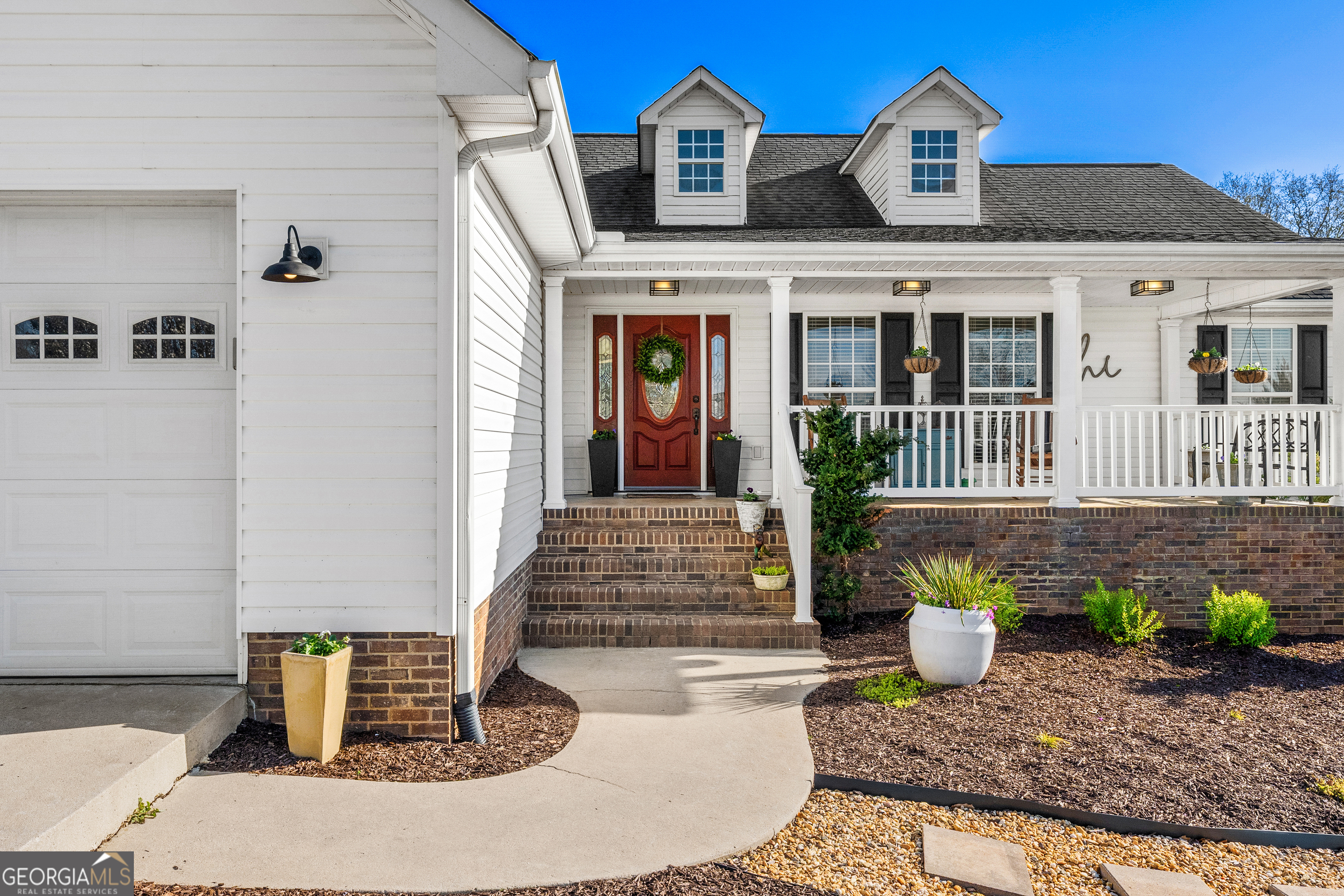 175 Highland Ridge Drive Hartwell, GA 30643 - Photo 4 of 46 a front view of a house with potted plants