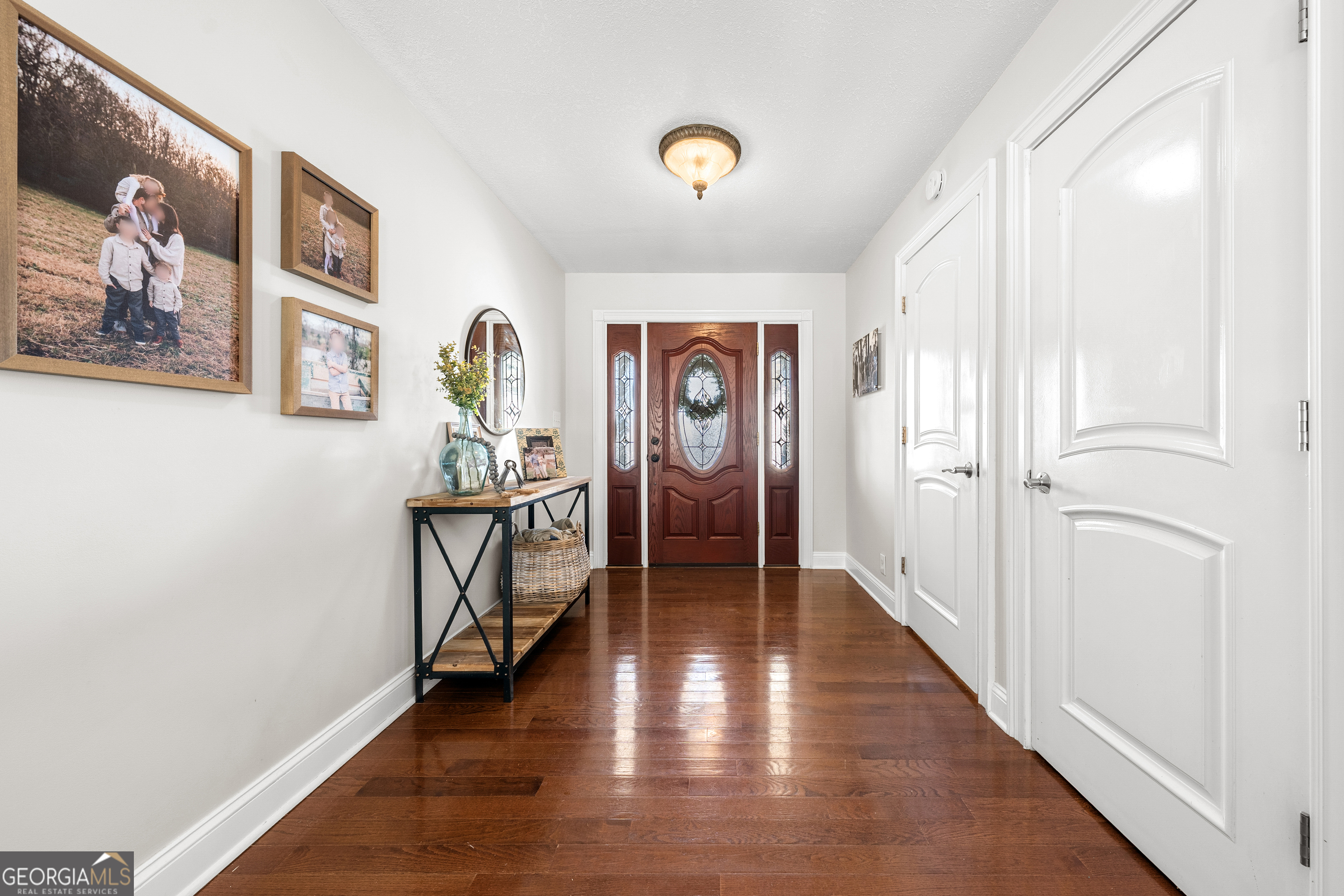 175 Highland Ridge Drive Hartwell, GA 30643 - Photo 8 of 46 a view of a hallway with wooden floor and furniture