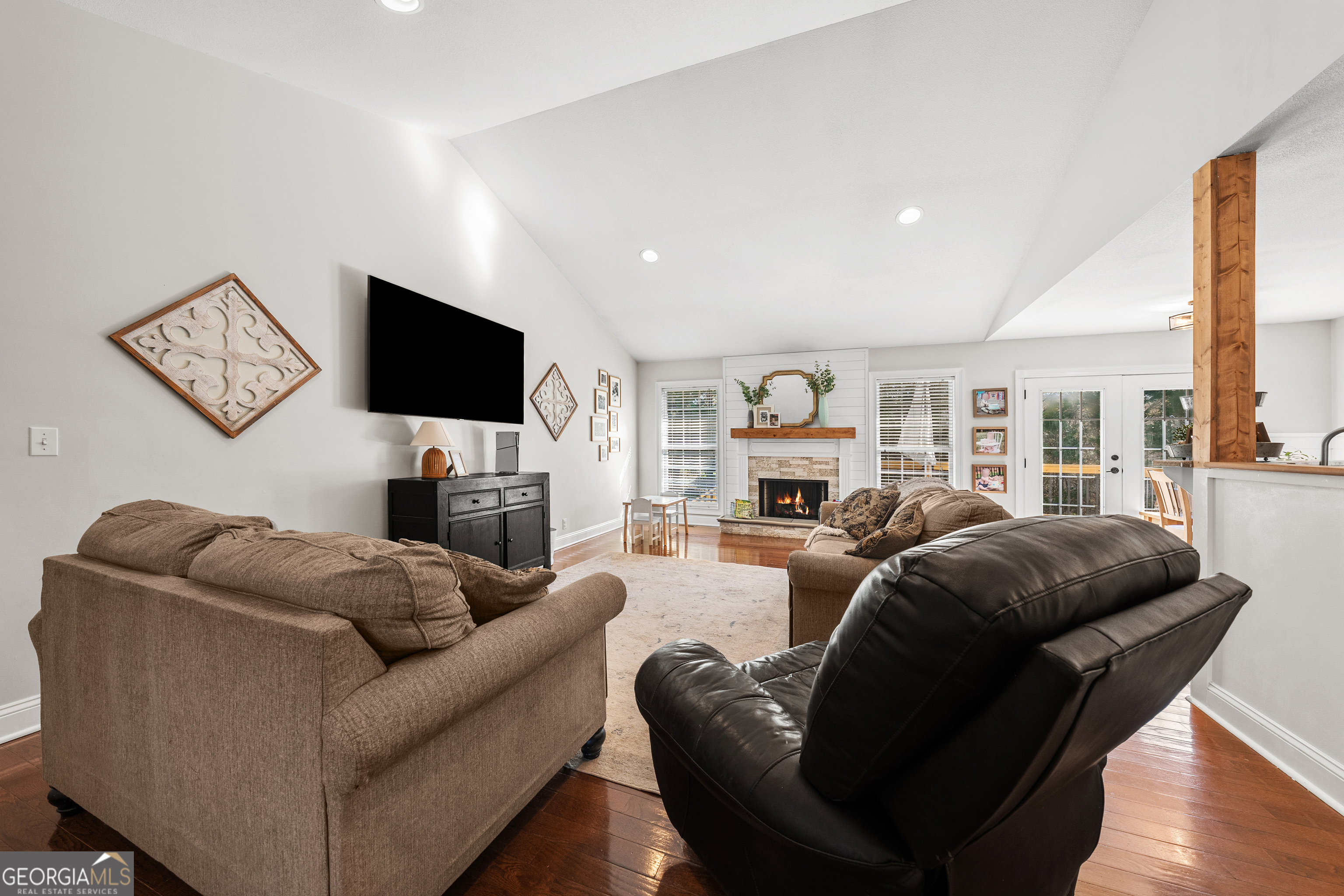 175 Highland Ridge Drive Hartwell, GA 30643 - Photo 9 of 46 a living room with furniture a flat screen tv and a large window