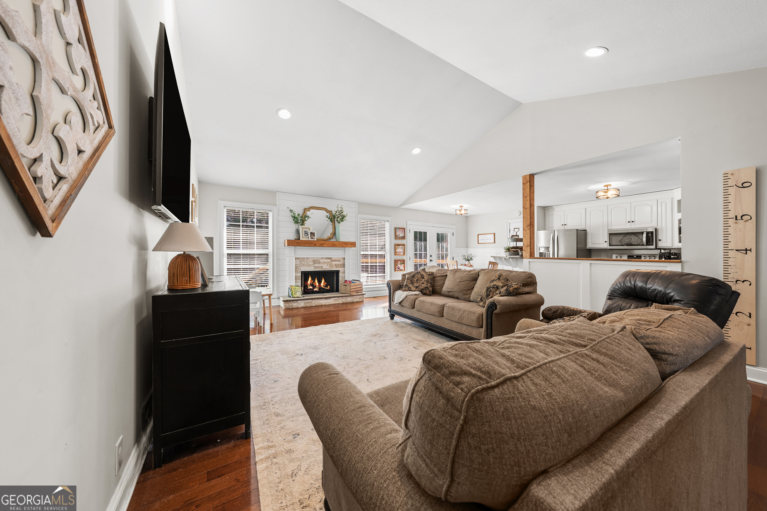 175 Highland Ridge Drive Hartwell, GA 30643 - Photo 10 of 46 a living room with fireplace furniture and a flat screen tv