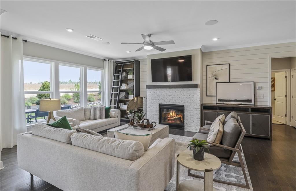 4397 Azalea Ridge Way Hoschton, GA 30548 - Photo 13 of 41 a living room with furniture fireplace and flat screen tv