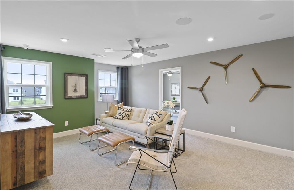 4397 Azalea Ridge Way Hoschton, GA 30548 - Photo 21 of 41 a living room with furniture and a window