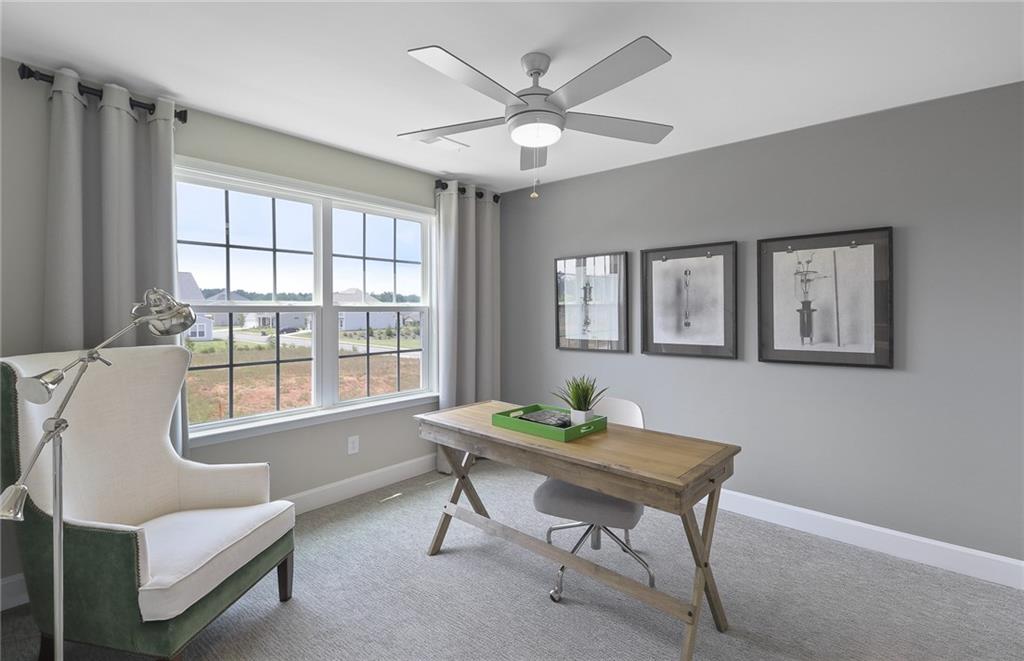 4397 Azalea Ridge Way Hoschton, GA 30548 - Photo 23 of 41 a living room with furniture and a window