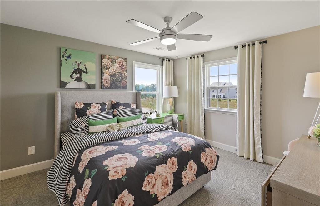 4397 Azalea Ridge Way Hoschton, GA 30548 - Photo 24 of 41 a bedroom with a large bed and a window