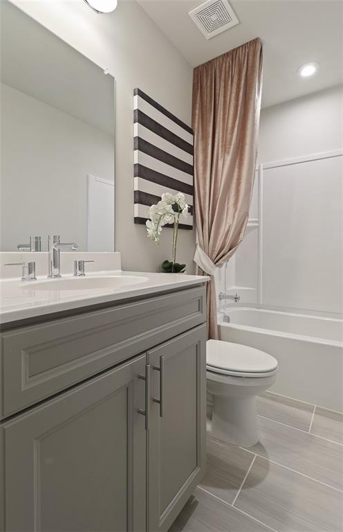 4397 Azalea Ridge Way Hoschton, GA 30548 - Photo 26 of 41 a bathroom with a sink a toilet and tub