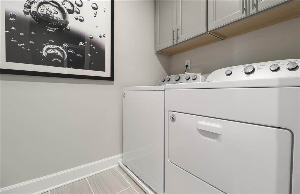4397 Azalea Ridge Way Hoschton, GA 30548 - Photo 28 of 41 a utility room with dryer and washer