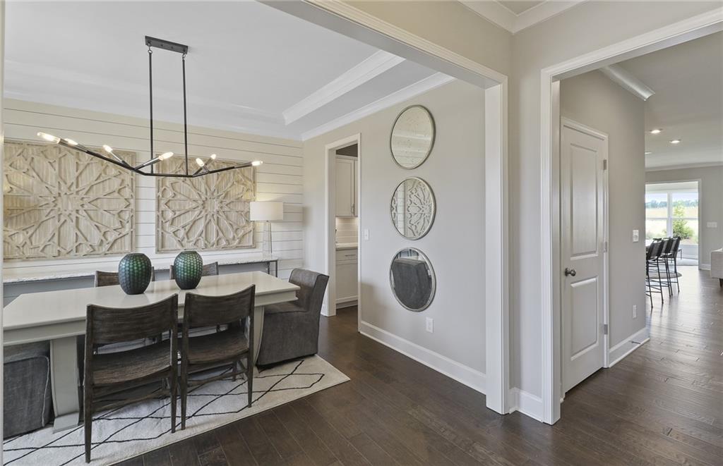 4397 Azalea Ridge Way Hoschton, GA 30548 - Photo 5 of 41 a view of a dining room with furniture and window