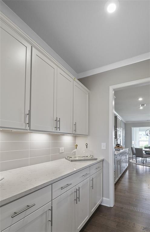4397 Azalea Ridge Way Hoschton, GA 30548 - Photo 8 of 41 a kitchen with granite countertop white cabinets and a sink