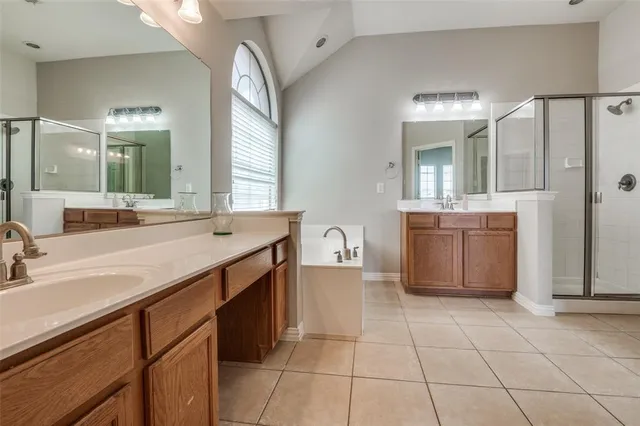 a spacious bathroom with a sink a mirror and a bathtub