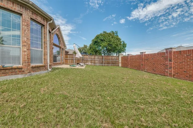a view of a backyard with a garden