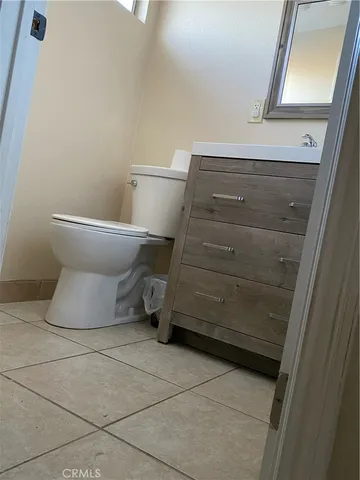 a bathroom with a toilet and shower