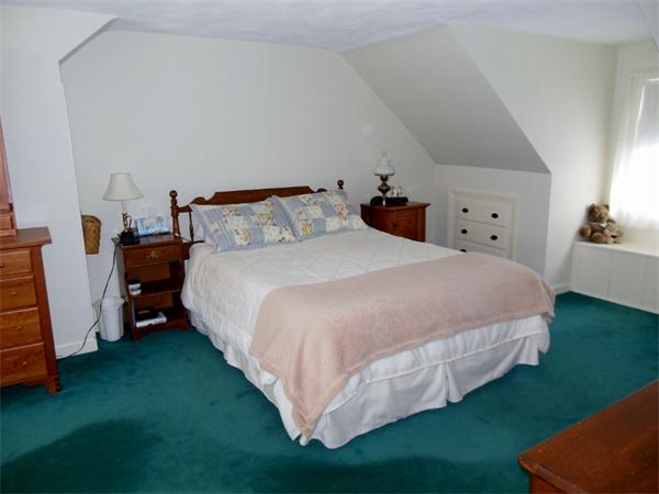 22 Esty Road Princeton, MA 01541 - Photo 12 of 25 a bed sitting in a bedroom next to a window