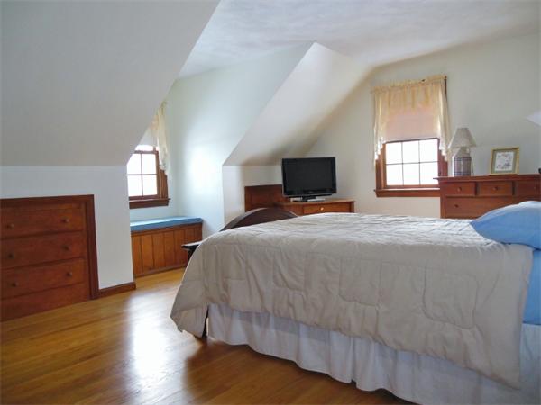 22 Esty Road Princeton, MA 01541 - Photo 14 of 25 a bedroom with a bed and wooden floor