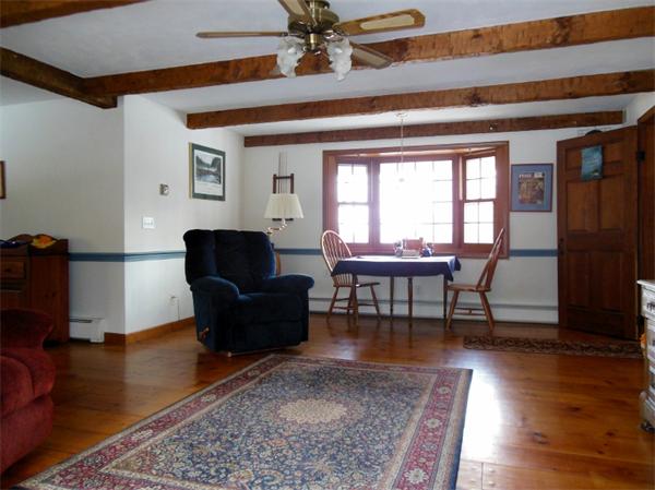 22 Esty Road Princeton, MA 01541 - Photo 2 of 25 a living room with furniture and a rug