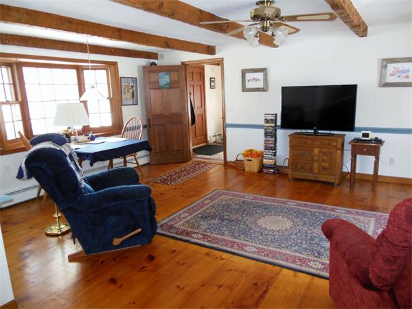 22 Esty Road Princeton, MA 01541 - Photo 4 of 25 a living room with furniture and a flat screen tv