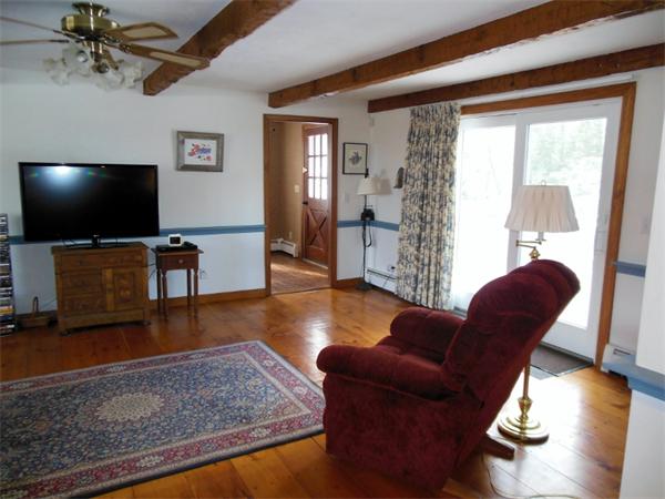 22 Esty Road Princeton, MA 01541 - Photo 5 of 25 a living room with furniture and a flat screen tv