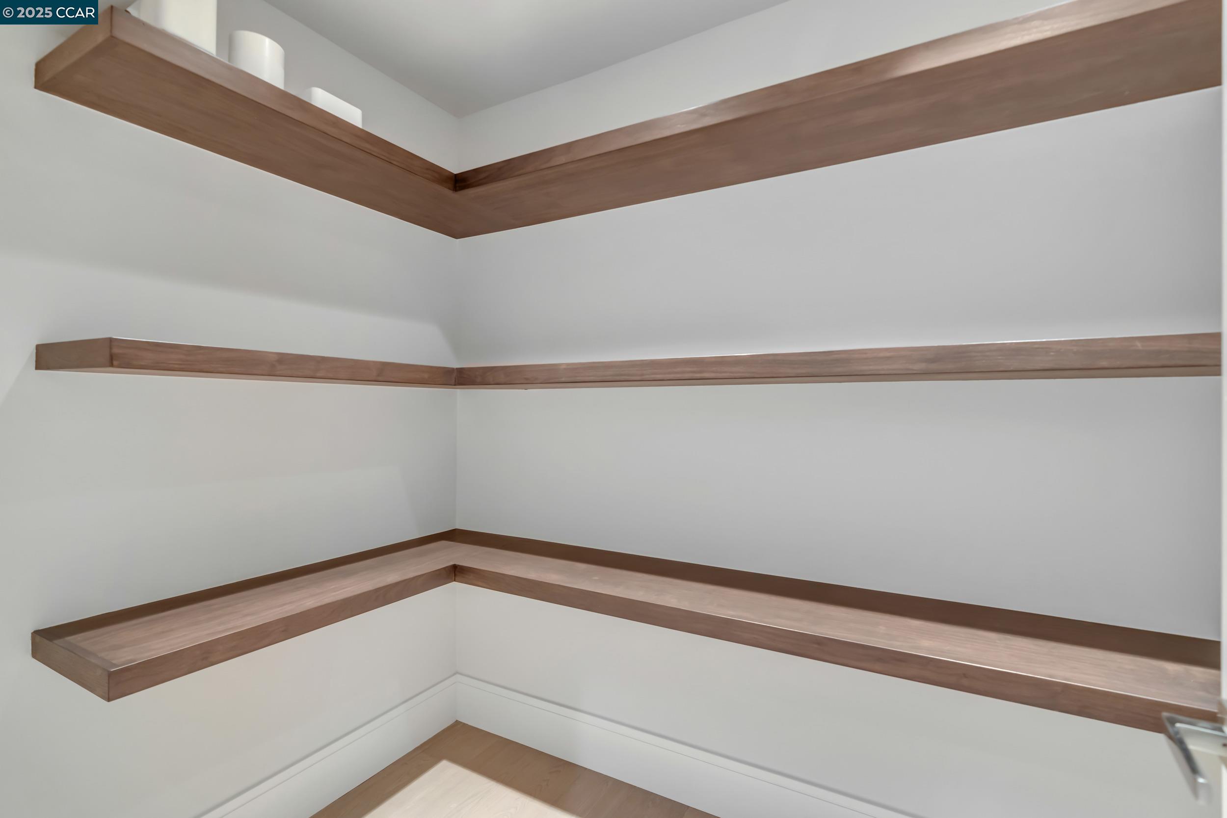 127 Caminar Way Walnut Creek, CA 94596 - Photo 13 of 60 a close up view of racks on the wall