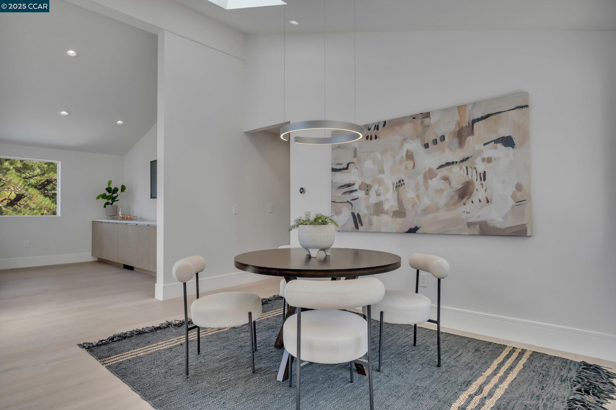127 Caminar Way Walnut Creek, CA 94596 - Photo 17 of 60 a view of a dining room with furniture and wooden floor