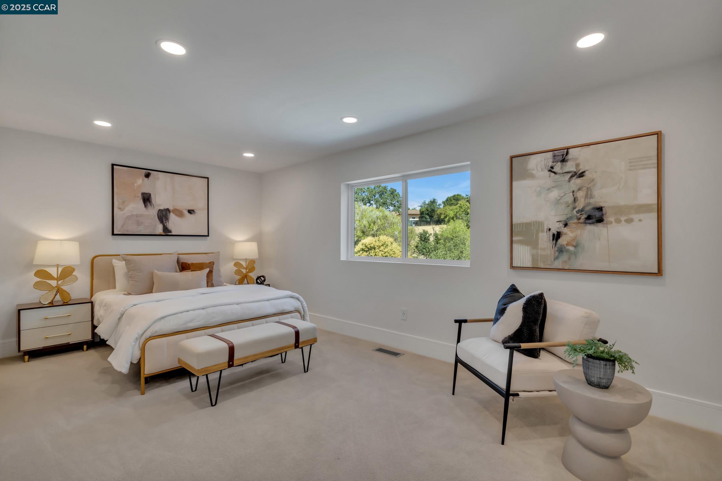 127 Caminar Way Walnut Creek, CA 94596 - Photo 30 of 60 a spacious bedroom with a bed and a painting on the wall