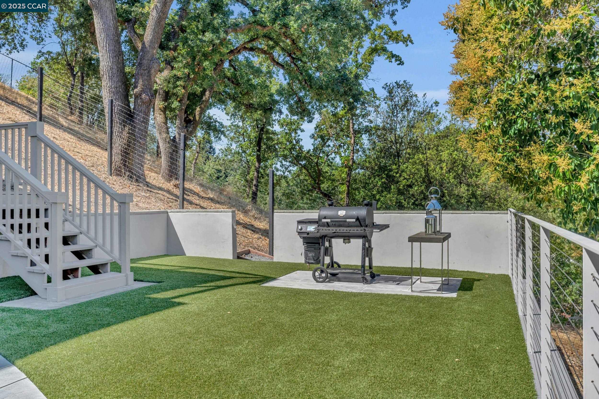 127 Caminar Way Walnut Creek, CA 94596 - Photo 44 of 60 a view of a chair and table in the garden