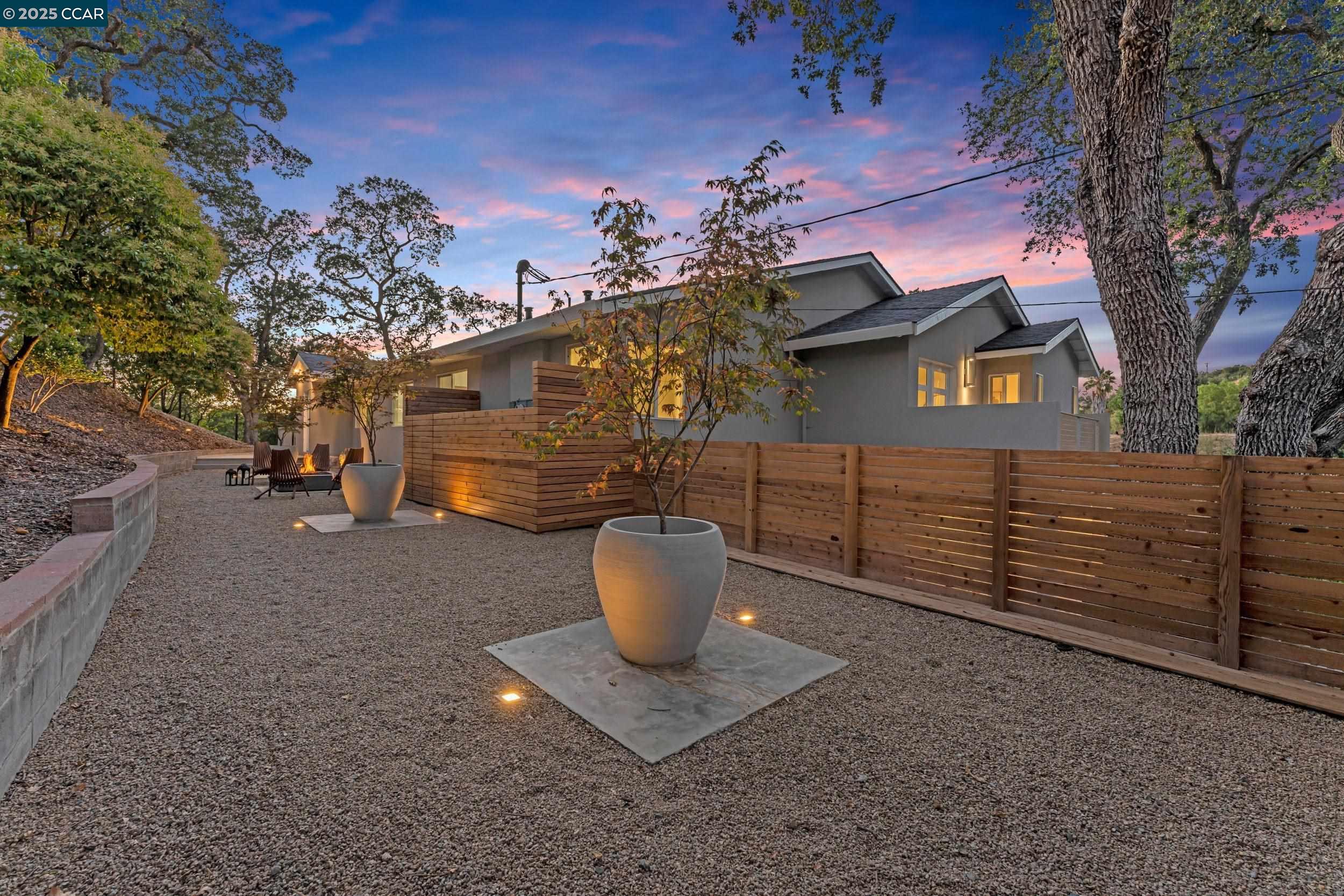 127 Caminar Way Walnut Creek, CA 94596 - Photo 52 of 60 a view of a backyard house with large trees