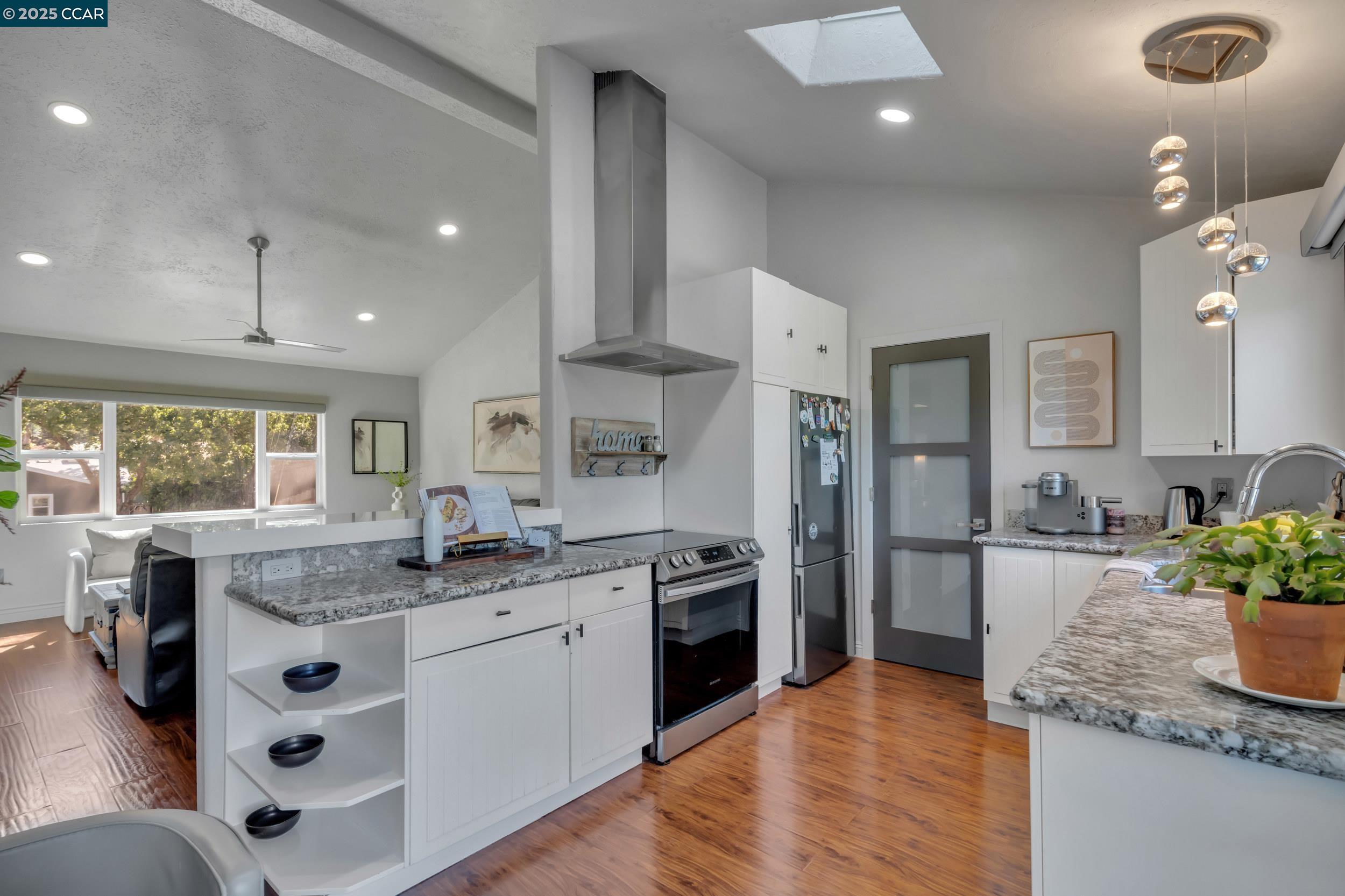 127 Caminar Way Walnut Creek, CA 94596 - Photo 54 of 60 a kitchen with stainless steel appliances granite countertop a sink stove and refrigerator