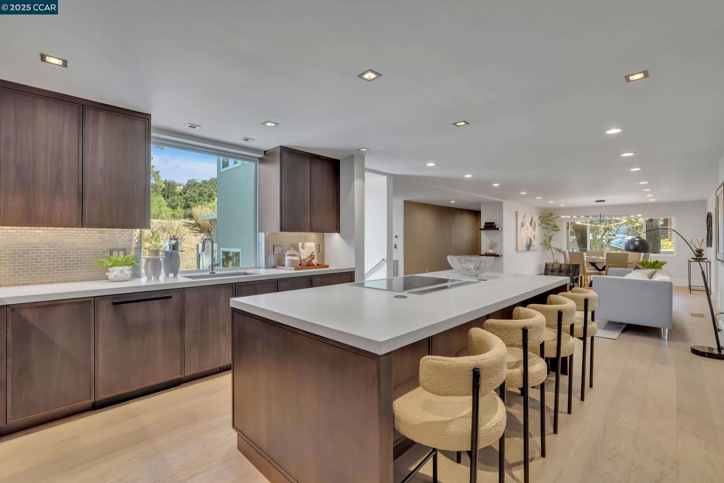 127 Caminar Way Walnut Creek, CA 94596 - Photo 10 of 60 a kitchen with a table and chairs in it