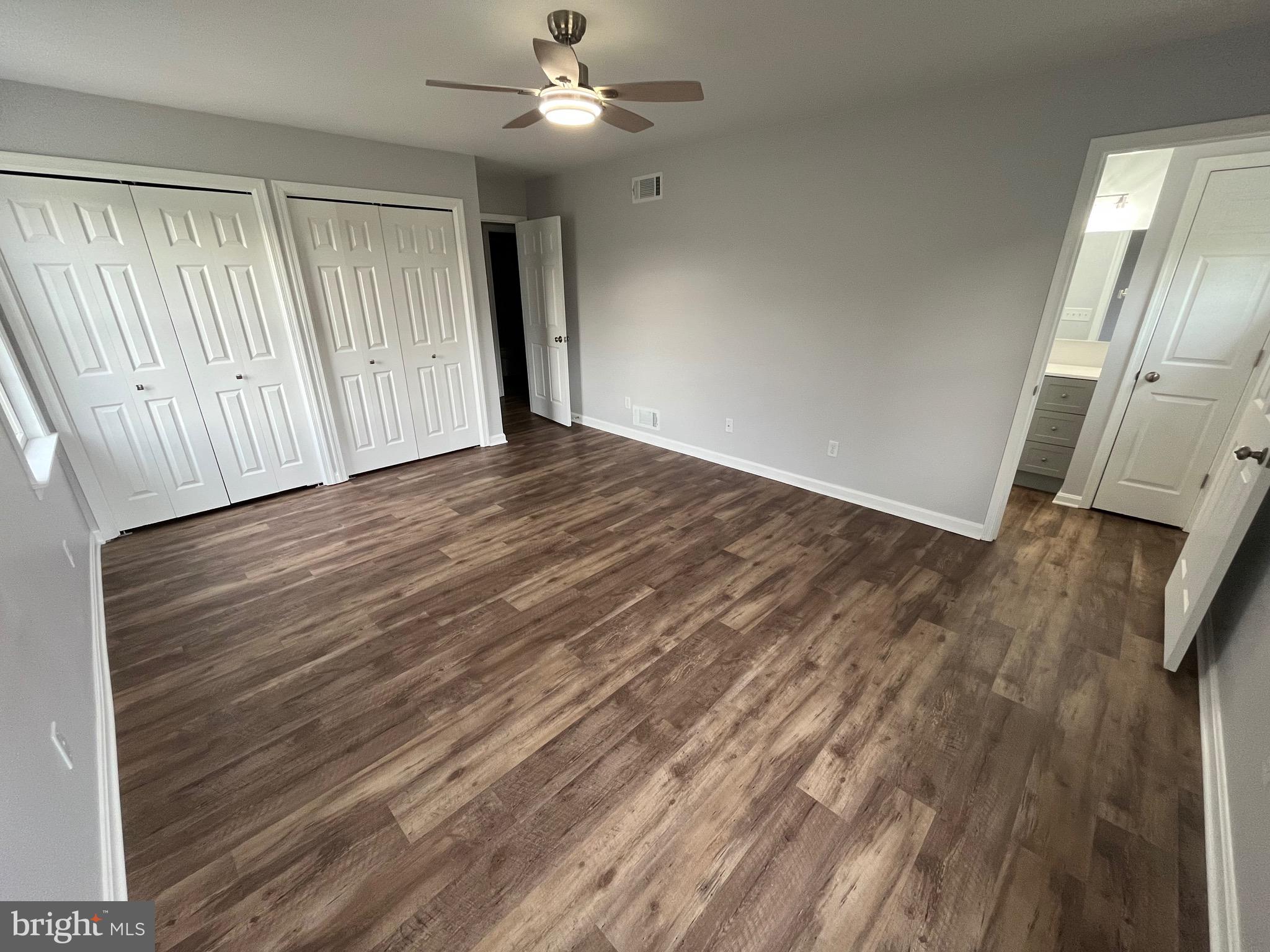 3077 Lakefield Road, Unit 3077 York, PA 17402 - Photo 17 of 33 wooden floor in an empty room with a window