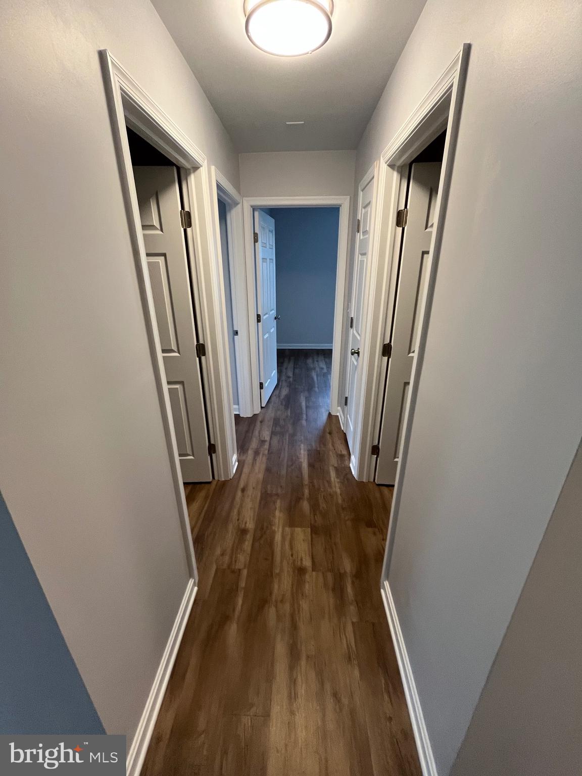 3077 Lakefield Road, Unit 3077 York, PA 17402 - Photo 10 of 33 a view of a hallway with wooden floor and staircase