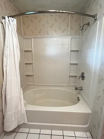 a bathroom with a bath tub