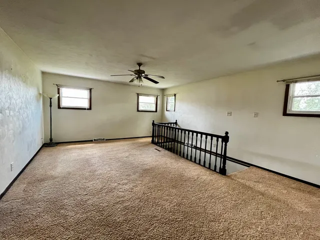 a view of a livingroom with a ceiling fan