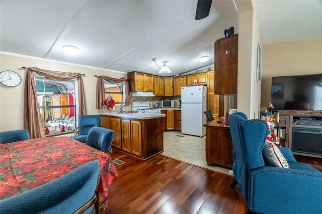 a large kitchen with a table and chairs in it