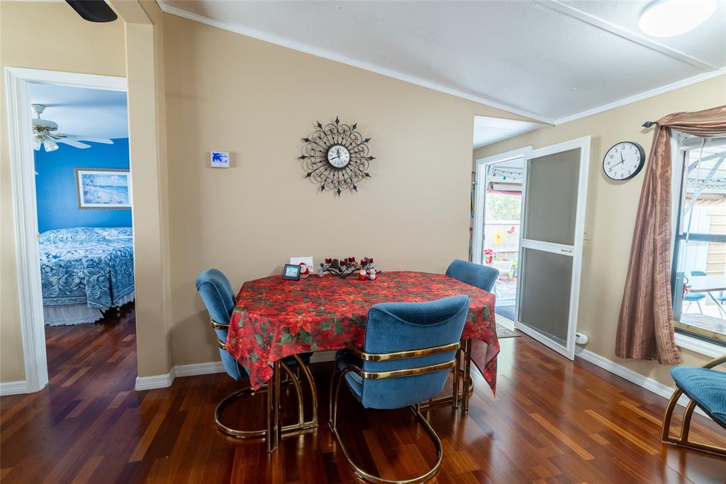 591 Marshburn Drive Bronson, FL 32621 - Photo 16 of 69 a view of a dining room with furniture and wooden floor