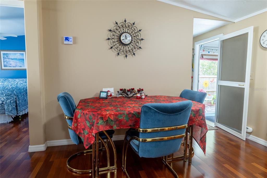 591 Marshburn Drive Bronson, FL 32621 - Photo 17 of 69 a view of a dining room with furniture and wooden floor