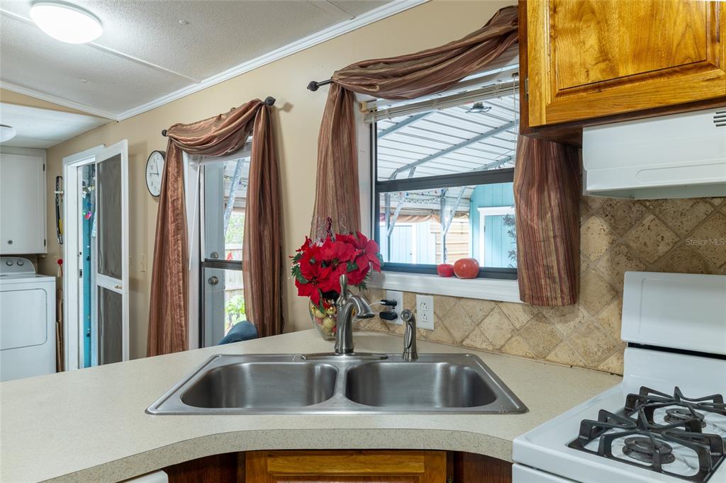 591 Marshburn Drive Bronson, FL 32621 - Photo 25 of 69 a kitchen with a sink cabinets and a large window