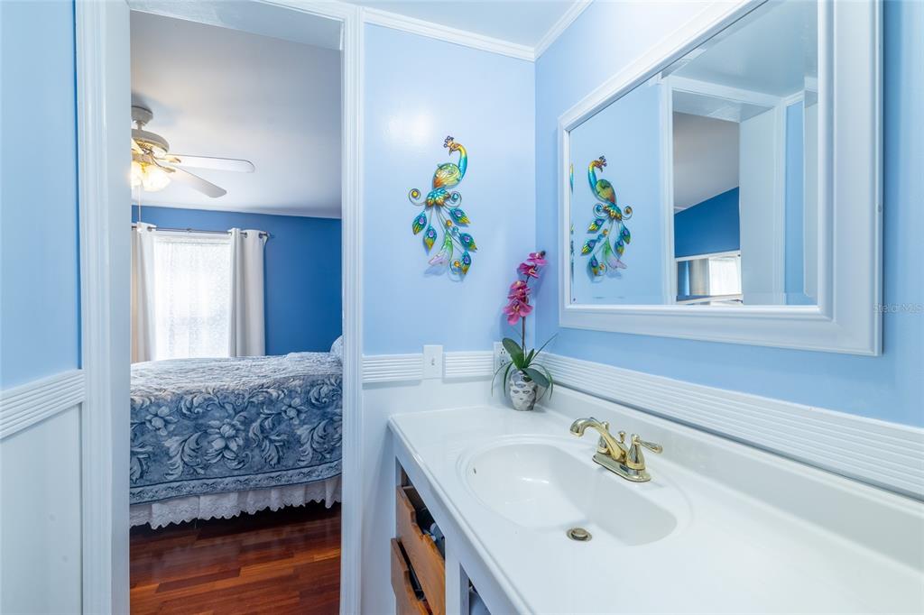 591 Marshburn Drive Bronson, FL 32621 - Photo 38 of 69 a bathroom with a granite countertop sink and a mirror