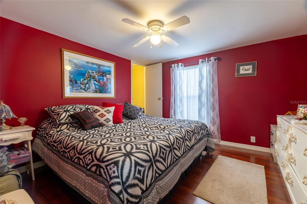 591 Marshburn Drive Bronson, FL 32621 - Photo 39 of 69 a bedroom with a bed and a chandelier