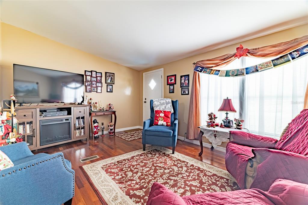 591 Marshburn Drive Bronson, FL 32621 - Photo 10 of 69 a living room with furniture and a flat screen tv