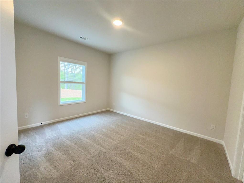 345 Rodeo Drive Auburn, GA 30011 - Photo 11 of 22 an empty room with windows