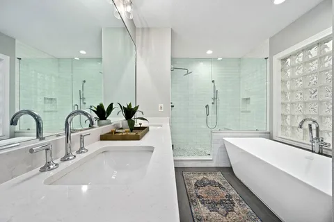 a bathroom with a bathtub and shower