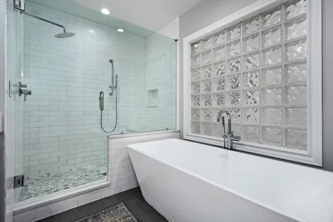 a bathroom with a double vanity sink mirror and double