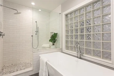 a view of a house with a yard and a tree