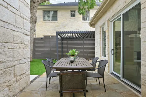 a view of a house with a yard and a garden