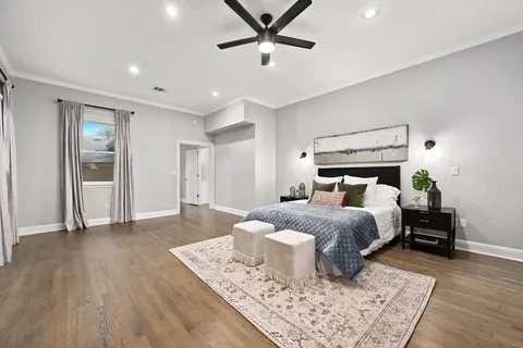 a bathroom with a double vanity sink a mirror a bathtub and shower