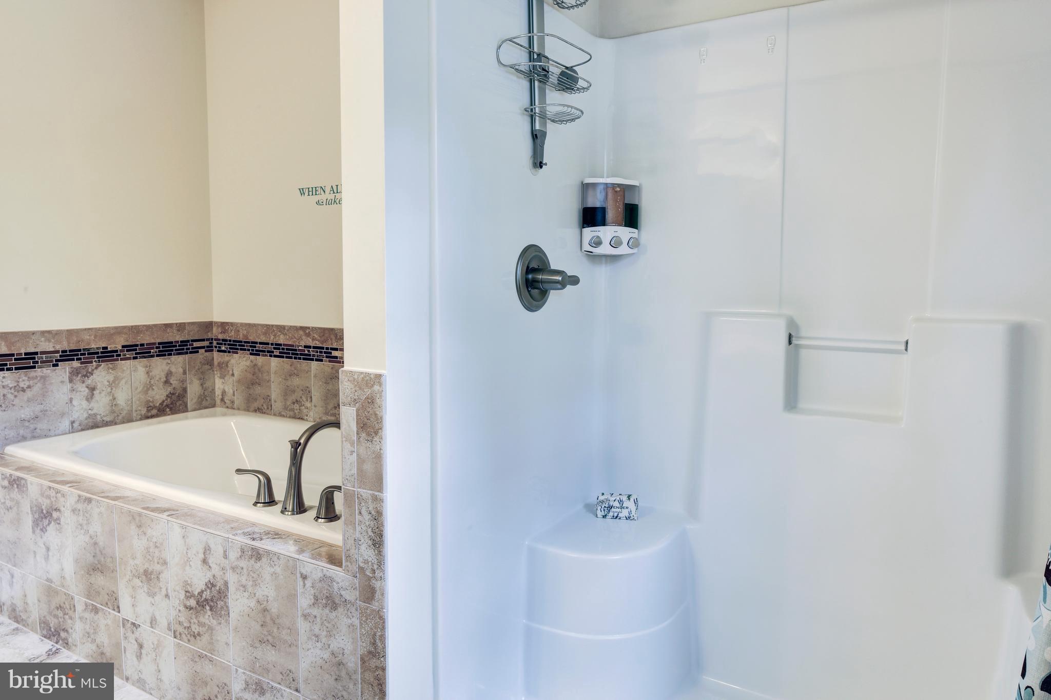 339 Chestnut Road Linthicum Heights, MD 21090 - Photo 13 of 30 a bathroom with a tub and shower