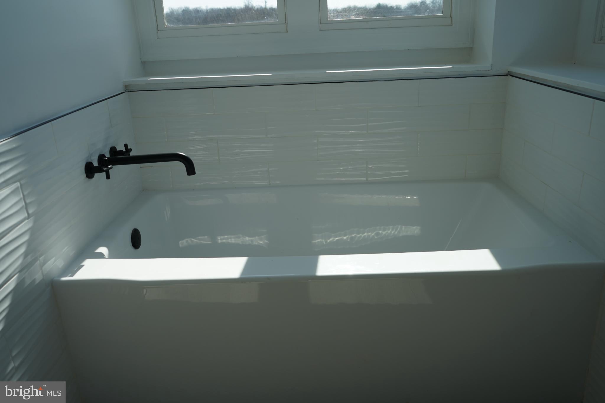 15604 Glen Ella Road Culpeper, VA 22701 - Photo 19 of 34 Sleek modern bathtub with natural light.